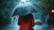 Woman holding an umbrella while it rains.