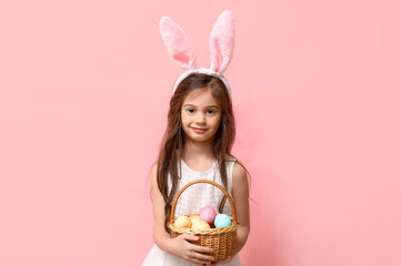 Sticker - Adorable little girl in bunny ears with basket of Easter eggs on pink background