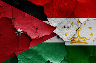 Wall Mural - flags of Jordan and Tajikistan painted on cracked wall