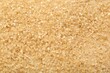 © New Africa - Granulated brown sugar as background, top view