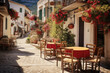 Outdoor cafe on a street of typical greek traditional village in Greece. Coffee with food on table for lunch