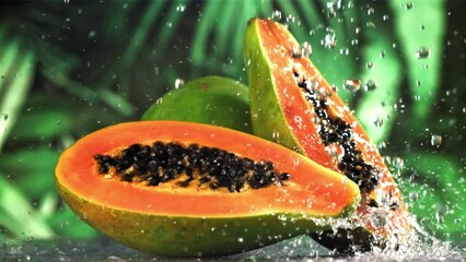 Canvas Print - Fresh tropical papaya with drops and splashes of water. Filmed on a high-speed camera at 1000 fps. High quality FullHD footage