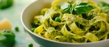Selective Focus On Spinach And Green Pea Pesto Accompanies Tagliatelle Pasta.
