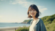 © Hamupata - 笑顔で海岸に立つ女性