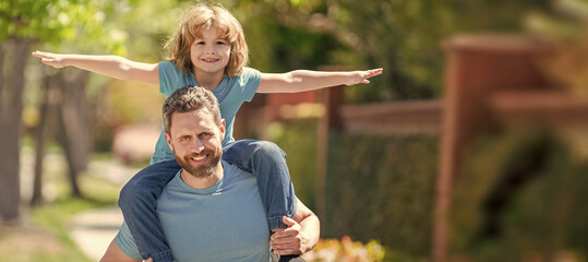 Wall Mural - Banner of father and son walk, happy father with kid relaxing together in park, togetherness