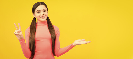 Canvas Print - product proposal. peace. kid presenting product, copy space. pretty teen girl advertising. Child face, horizontal poster, teenager girl isolated portrait, banner with copy space.