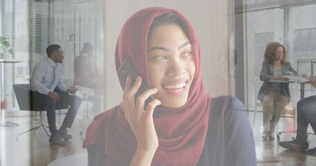 Poster - Image of biracial businesswoman on phone over people walking and cityscape