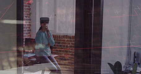 Poster - Image of asian businessman wearing vr headset in office over cityscape