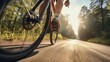 Closeup of young cyclist’s legs pedaling fast on a mountain bike trail