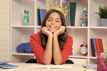 Poster - Princess school girl. Portrait of dreaming teenage girl with crown, feeling princess. Child princess crown on isolated studio background.