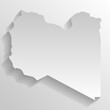 Libya country silhouette. High detailed map. White country silhouette with dropped long shadow on beige background.