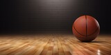 Fototapeta Sport - Basketball Resting on a Glossy Hardwood Floor.