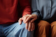 © Clique Images - Close-up of unrecognizable woman touching mans hand to support him