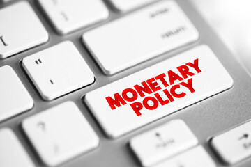 Monetary Policy - set of actions to control a nation's overall money supply and achieve economic growth, text concept button on keyboard