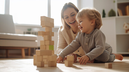 Wall Mural - Mom and child play with wooden blocks