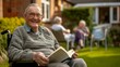 Senior man in a wheelchair reading a book outdoors, showcasing leisure in retirement and the importance of active aging with a sense of independence