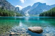 A serene alpine lake with crystal clear water and majestic mountains in the background, illustrating tranquility and grandeur