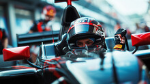 A Race Car Driver Gearing Up In A Formula 1 Car Moments Before The Race.
