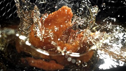 Poster - Chicken nuggets fall into hot oil. Filmed on a high-speed camera at 1000 fps. High quality FullHD footage