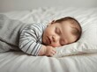© Arceli - Cute chubby baby boy sleeping on plain white bed background from Generative AI