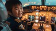 Happy Asian Kid as Airplane Captain joyful child dressed in a pilot suit poses inside the plane's cockpit, dreaming of their future job as an airplane captain. With a beaming smile of excitement,