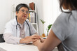 © Pormezz - doctor holds hands and encouraging patient to pass treatment cancer.
