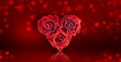 Valentine's Day card with roses bouquet in the shape of heart on a red background with glowing bokeh, wide banner.