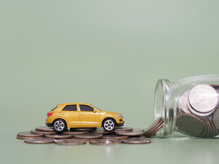 Poster - Toy car and stack of coins. The concept of saving money and manage to success transport business