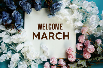 Sticker - Welcome March text message with flower decoration on wooden background