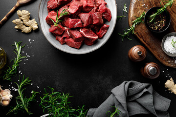 Poster - Beef meat entrecote sliced, raw beef meat fillet on black background, top view