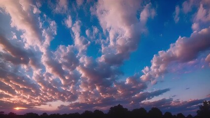 Poster - Wispy Altocumulus Castell clouds dominate the evening sky adding a touch of magic to dusk.