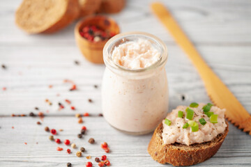 Wall Mural - Tuna Pate Bruschetta with green onion, fish rillettes on wooden board