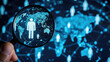 © kiatipol - Human icon inside of magnifier glass with world map for customer focus analysis target group and customer relation management concept.