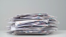 Time Lapse Of Paper Sheets On White Background. Stop Motion Animation Of Big Heap Of Business Paper Documents With Clips At The Desk