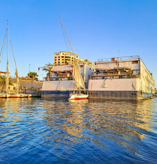 A small shuttle which stands between two large liners on the blue Nile. Egypt