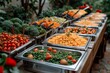 A vibrant display of whole, fresh, and local foods fills the outdoor buffet table, offering a diverse assortment of natural ingredients for a healthy and nourishing diet