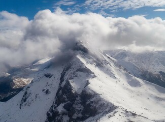 Canvas Print - Aerial view of mountains. Snowy mountain range. The Andes Mountains. South American winter travel.