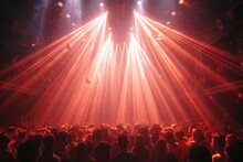A Pulsing Sea Of Bodies Enveloped In The Electrifying Glow Of Laser Lights, Swaying To The Rhythm Of The Music On The Stage At A Raucous Concert Event