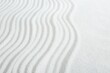 Leinwandbild Motiv Zen rock garden. Wave pattern on white sand, closeup