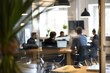 © Paul - Casual Professionalism: Well-Lit Business Office with a Spacious Feel, Professionals in Casual Attire. Subtle Bokeh Background Adds a Contemporary Flair. Generative AI