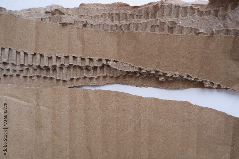 Torn cardboard paper for using as a text box. torn cardboard paper for background and design material.