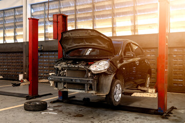 Wall Mural - car repair in garage service station with soft-focus and over light in the background