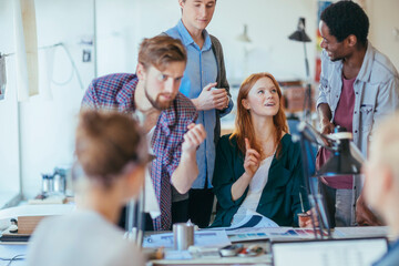 Diverse group of young designers working in an office