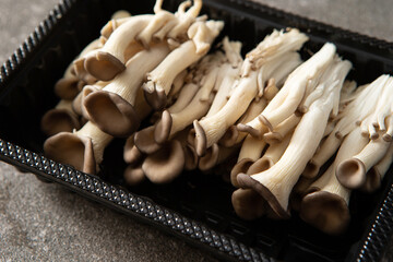 Canvas Print - Oyster mushrooms in a packaging container	