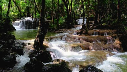 Wall Mural - Erawan Waterfall Thailand, a beautiful deep forest waterfall in Thailand. Erawan Waterfall in National Park. green forest with waterfalls