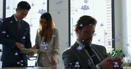 Poster - Image of network of digital icons over businesspeople using smartphone and tablet