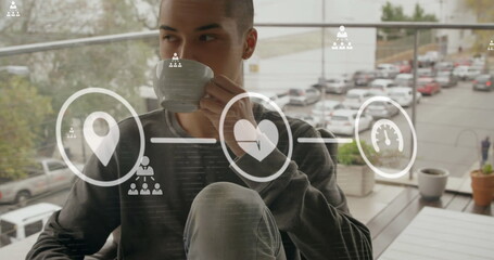 Poster - Digital icons and network of profile icons against man drinking coffee in the balcony