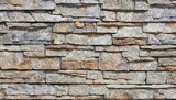Fototapeta Do pokoju - A seamless texture of rock walling material. A stone veneer that is applied to the walls of buildings