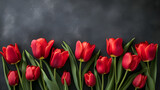 Fototapeta Tulipany - Red tulip flowers on black border background top view.generative ai