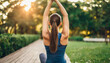  woman with a toned back practicing yoga at sunrise, embodying serenity and strength in a peaceful outdoor setting
